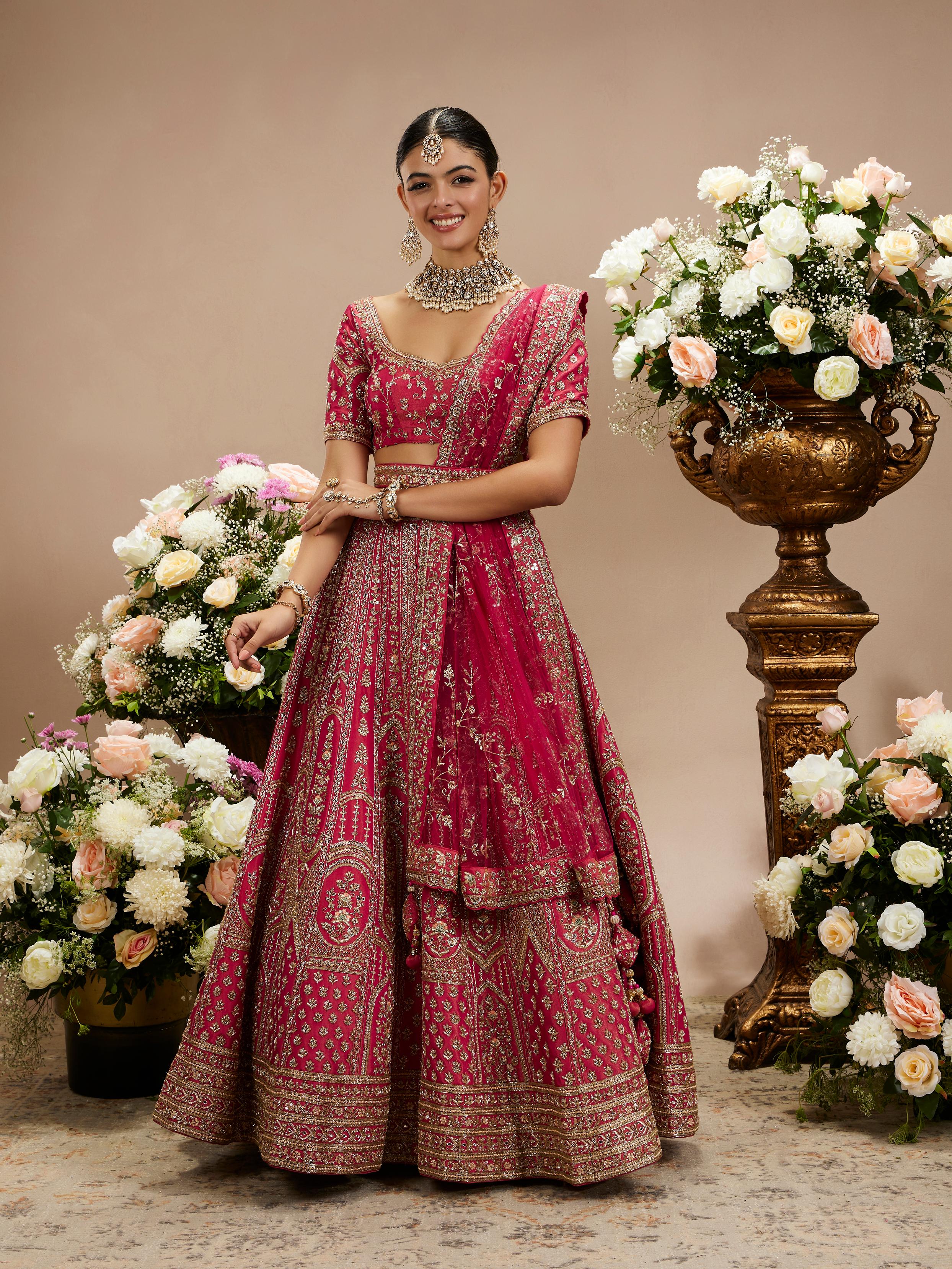 Twamev Women Rani Pink Zari Embroidered Lehenga with Floral And Buta Motifs And Pillow Trim Latkans