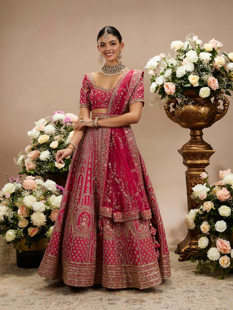 Twamev Women Rani Pink Zari Embroidered Lehenga with Floral And Buta Motifs And Pillow Trim Latkans