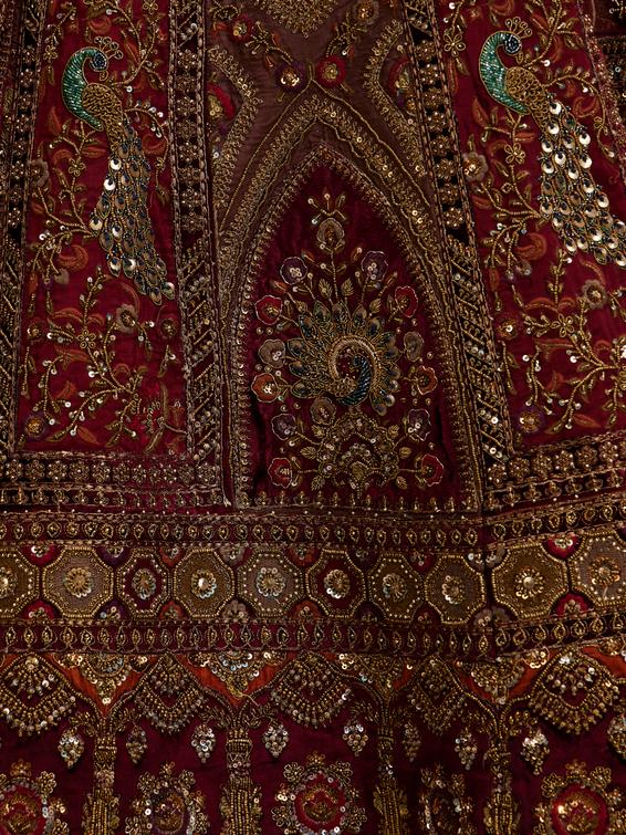 Twamev Women Maroon Red Jhallar Patterned Lehenga with Peacock And Pillow Trim Latkans