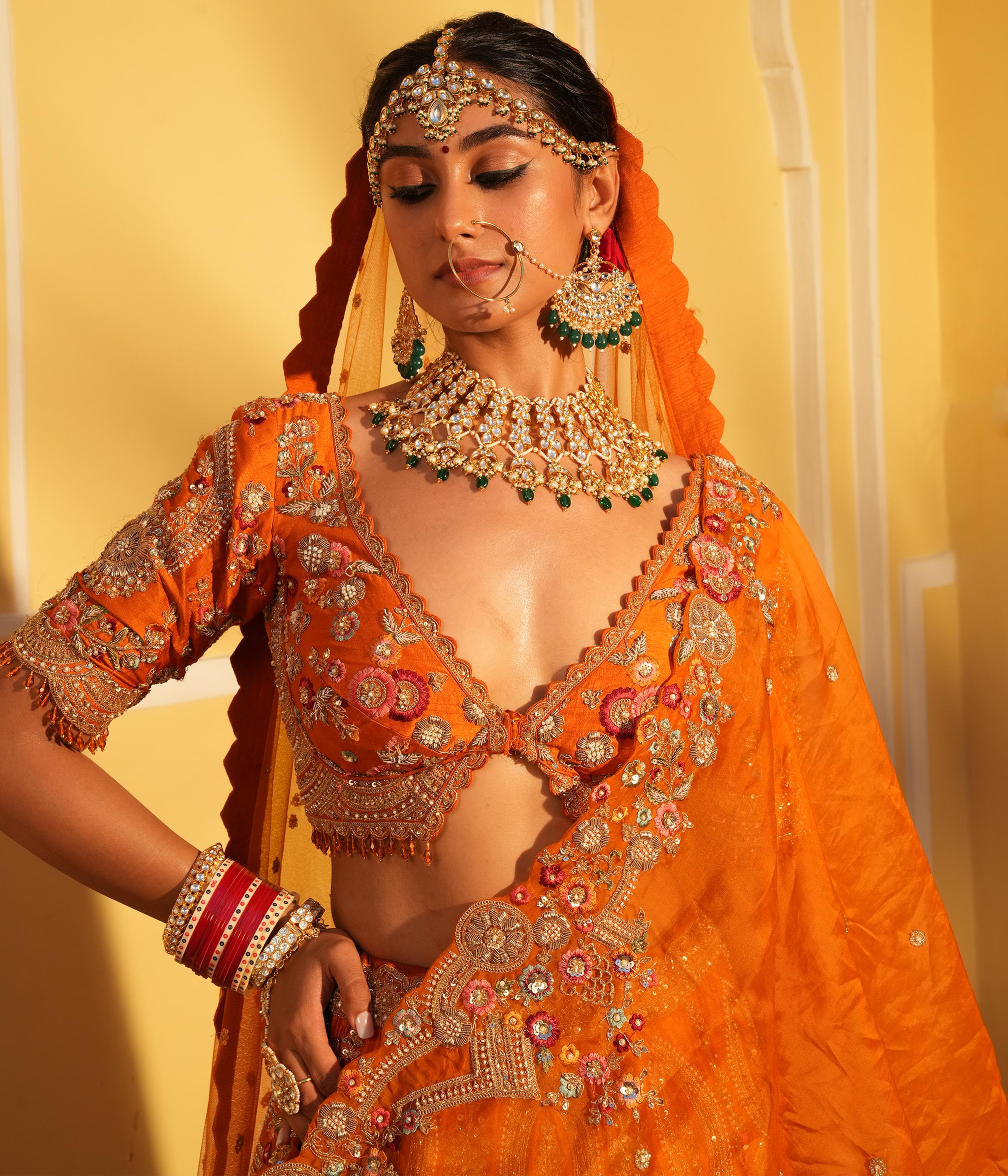 Twamev Women Twinkling Orange Lehenga Spectacle