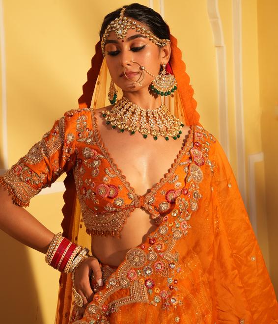 Twamev Women Twinkling Orange Lehenga Spectacle