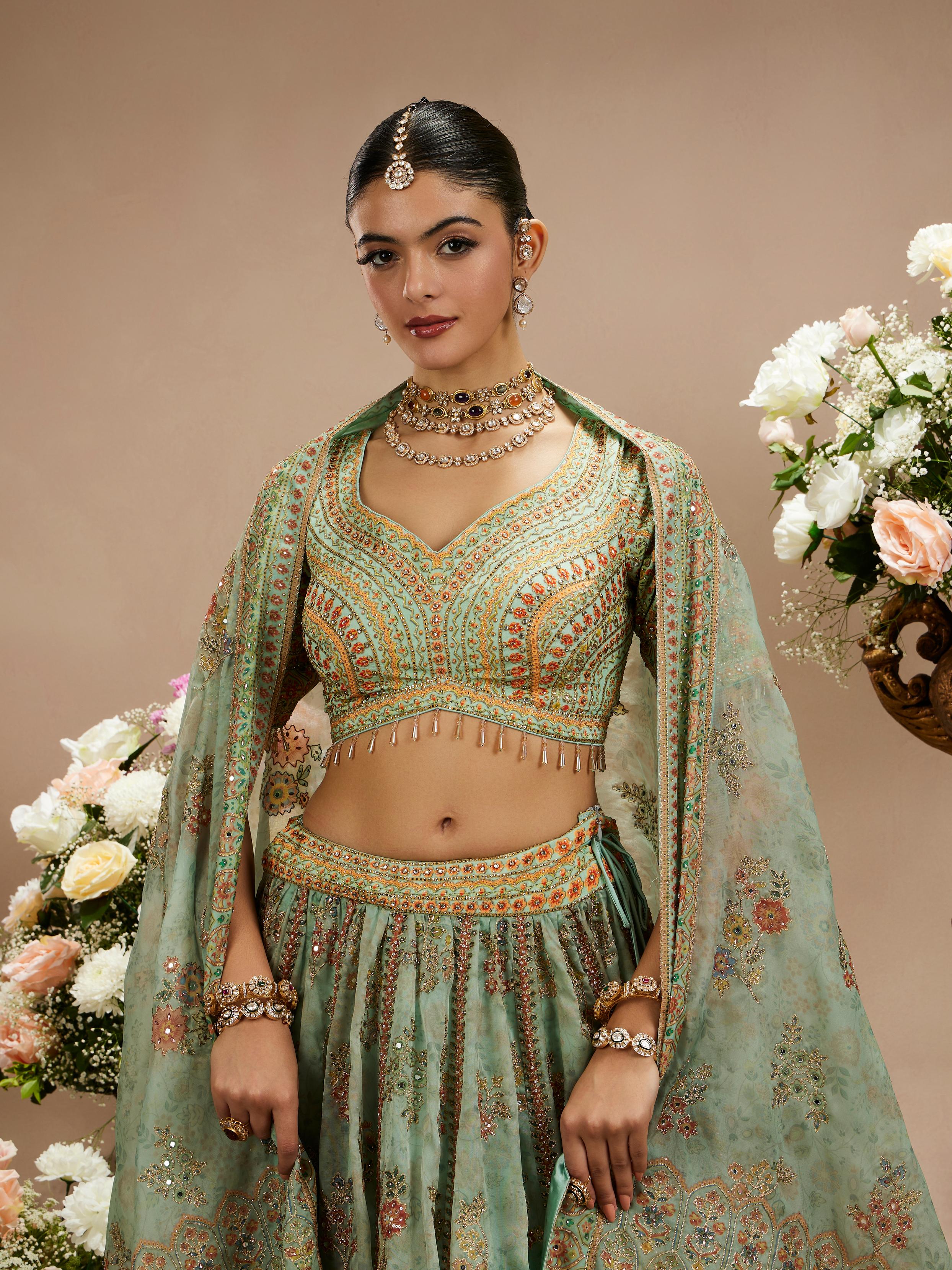 Twamev Women Sea Green Floral Embroidered Lehenga with Mirror Work And Tassled Blouse