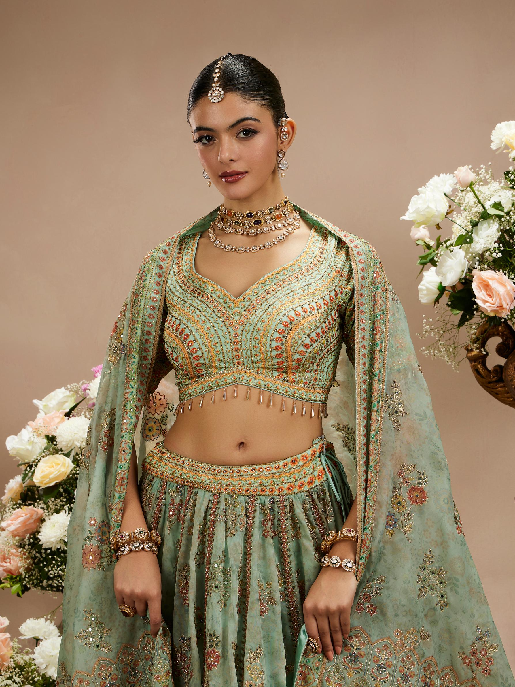 Twamev Women Sea Green Floral Embroidered Lehenga with Mirror Work And Tassled Blouse