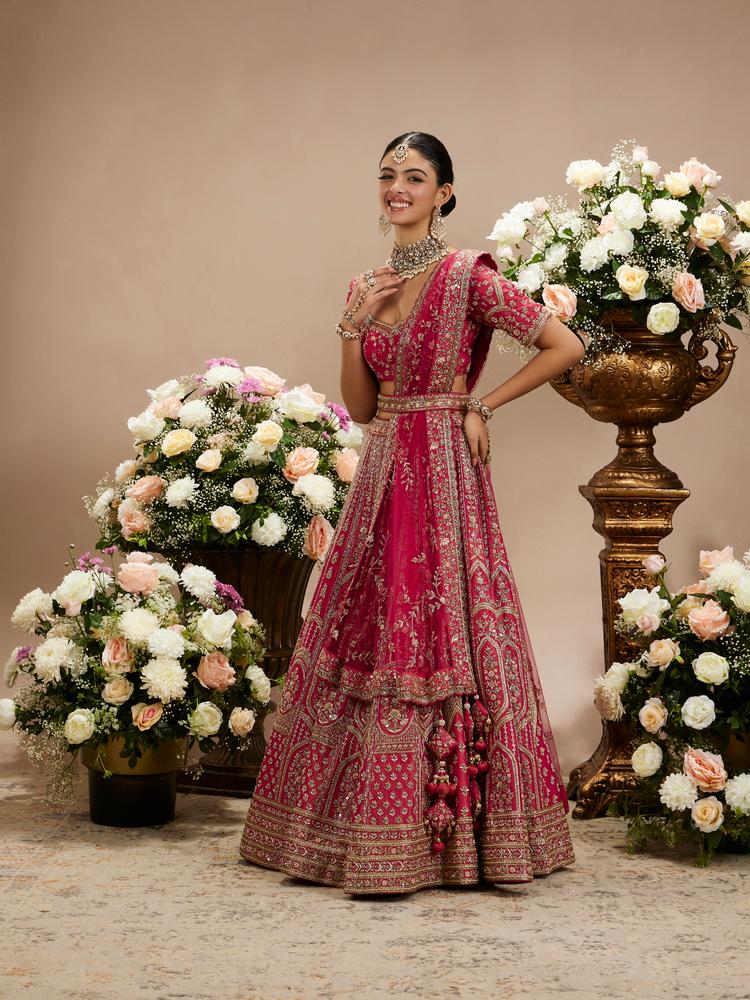 Twamev Women Rani Pink Zari Embroidered Lehenga with Floral And Buta Motifs And Pillow Trim Latkans