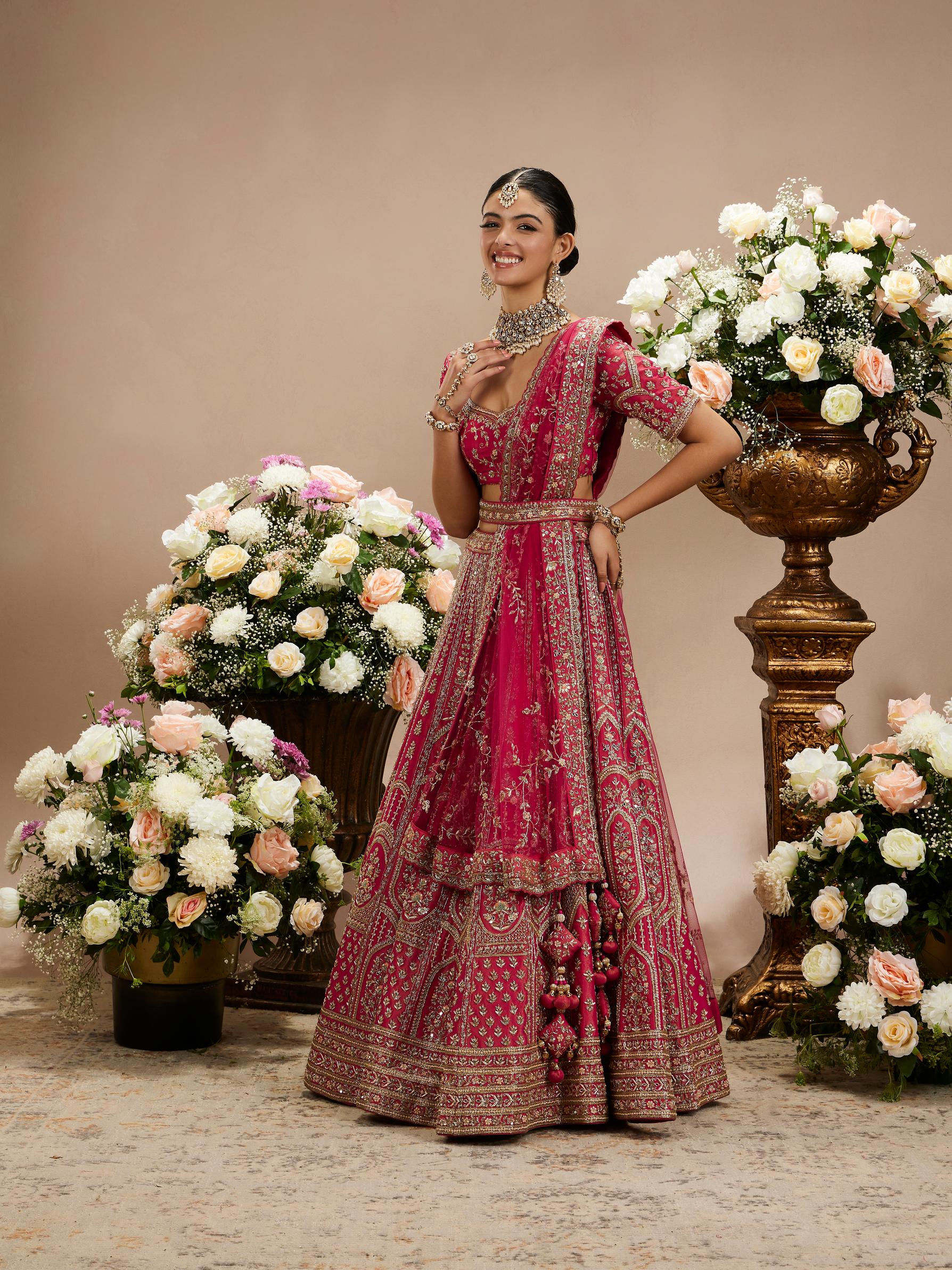 Twamev Women Rani Pink Zari Embroidered Lehenga with Floral And Buta Motifs And Pillow Trim Latkans