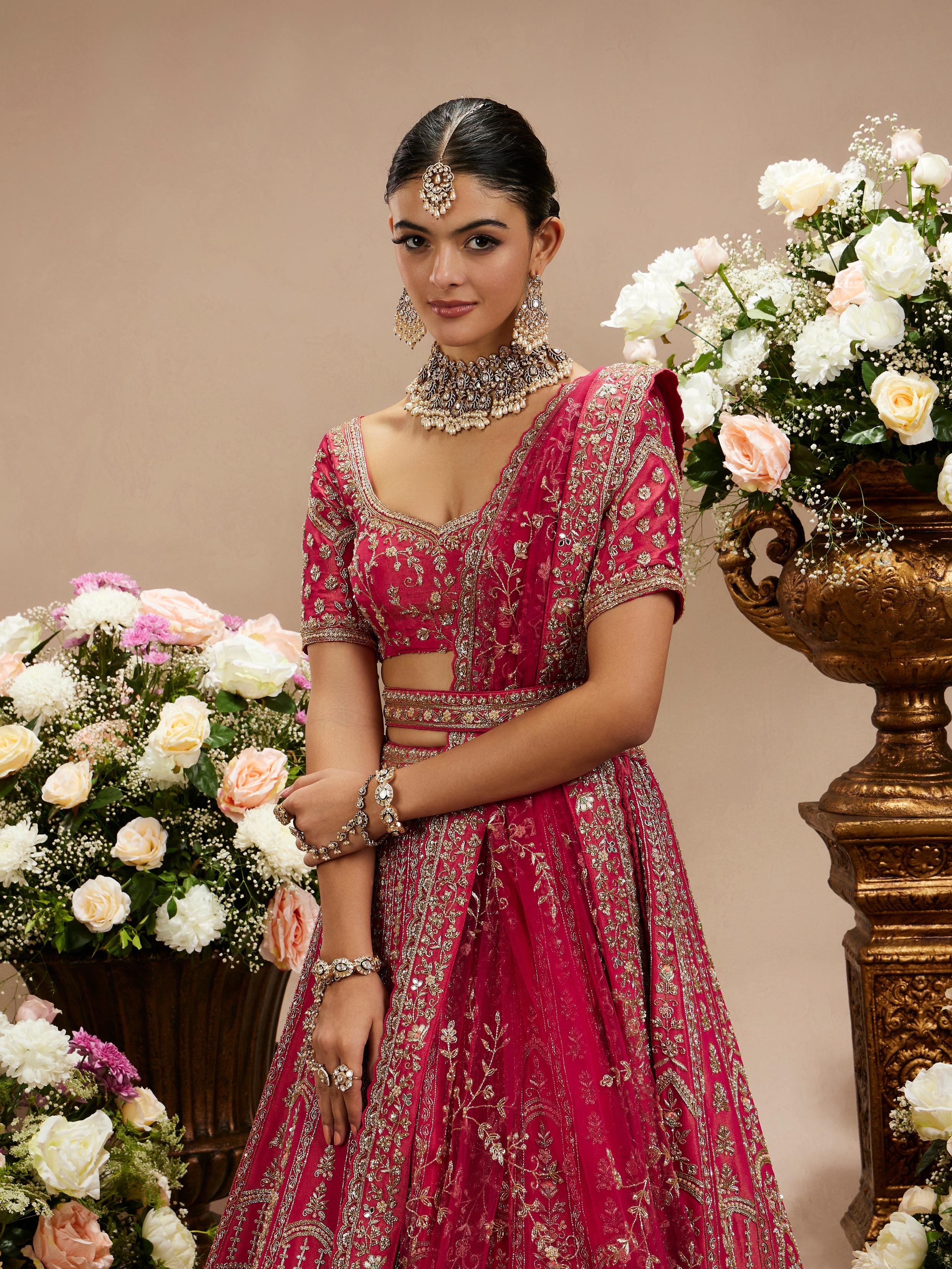 Twamev Women Rani Pink Zari Embroidered Lehenga with Floral And Buta Motifs And Pillow Trim Latkans
