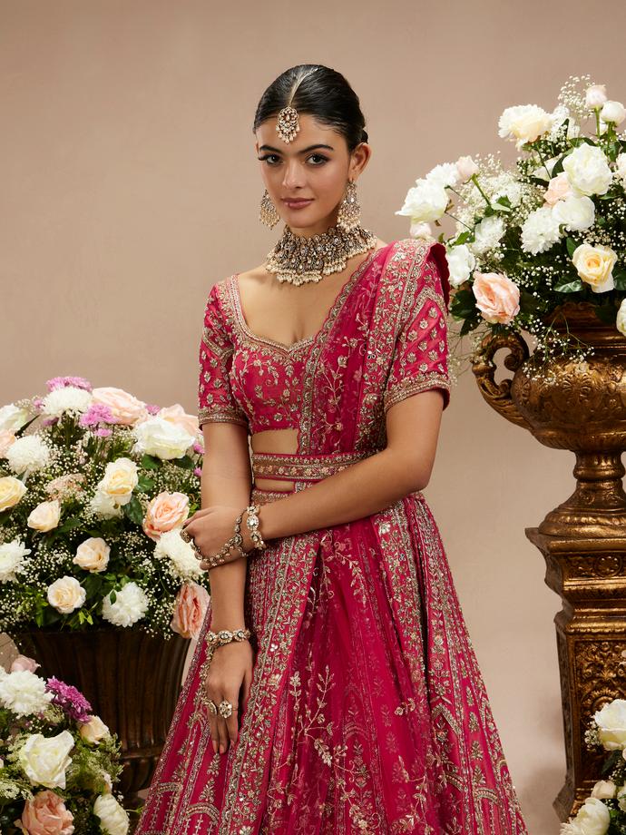 Twamev Women Rani Pink Zari Embroidered Lehenga with Floral And Buta Motifs And Pillow Trim Latkans