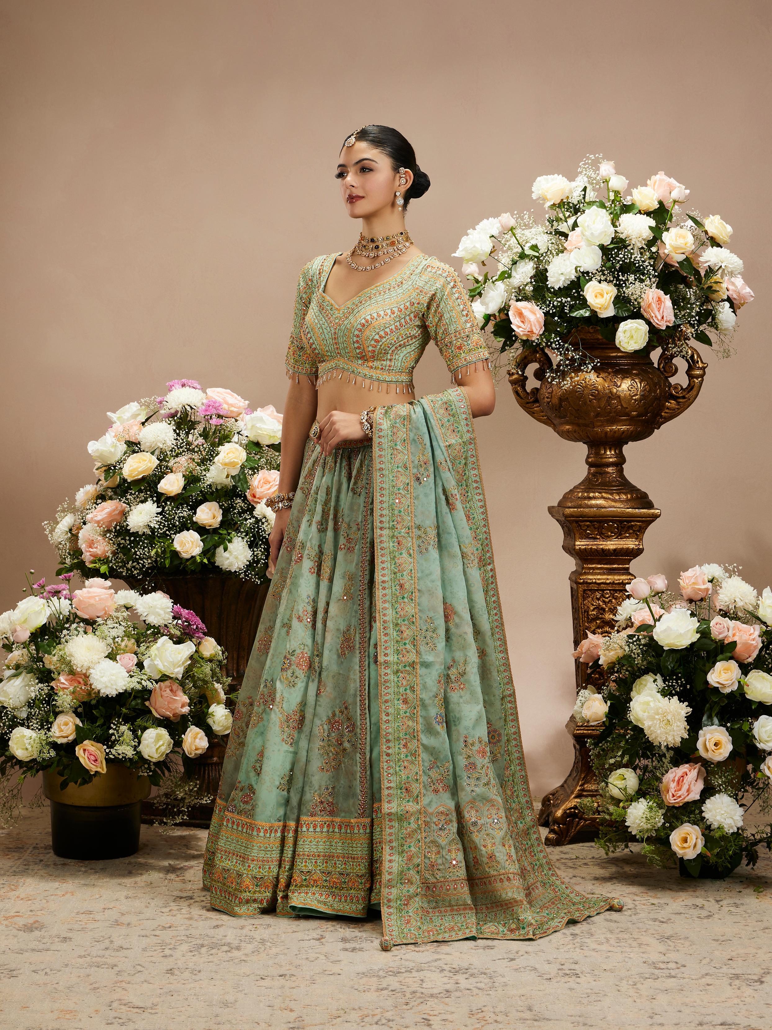Twamev Women Sea Green Floral Embroidered Lehenga with Mirror Work And Tassled Blouse