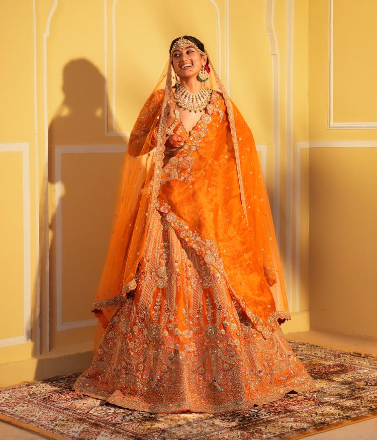 Twamev Women Twinkling Orange Lehenga Spectacle